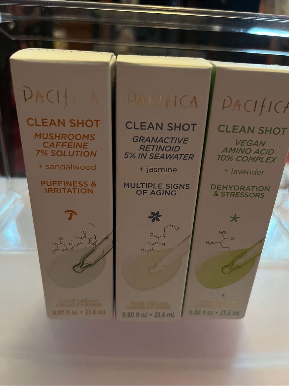 Pacifica Clean Shot Serums in White with Gold, Gray, and Green Accents
